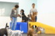 Two Dogtopia Canine Coaches in playroom with a group of dogs.
